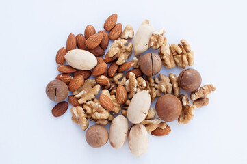 a set of nuts of different types lies on a light background