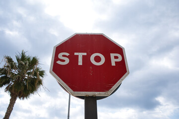 stop traffic sign with clouds