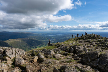 Fototapeta premium People on summit of Lake District mountain 