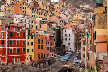 Fototapeta na wymiar Village of Riomaggiore in Cinque Terre at the Italian coast - travel photography