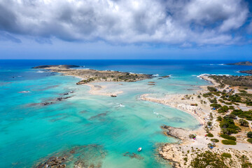 Matala beach with caves on the rocks that were used as a roman cemetery and at the decade of 70's were living hippies from all over the world, Crete, Greece