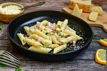  Fresh home made italian  penne  pasta   alla carbonara with  cream sauce  ,  bacon,egg, parmesan cheese ,olive oil and black pepper) 