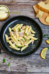  Fresh home made italian  penne  pasta   alla carbonara with  cream sauce  ,  bacon,egg, parmesan cheese ,olive oil and black pepper) 