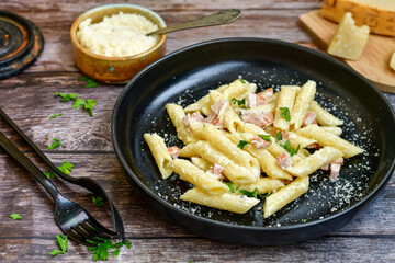  Fresh home made italian  penne  pasta   alla carbonara with  cream sauce  ,  bacon,egg, parmesan cheese ,olive oil and black pepper) 