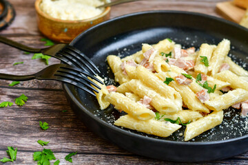  Fresh home made italian  penne  pasta   alla carbonara with  cream sauce  ,  bacon,egg, parmesan cheese ,olive oil and black pepper) 
