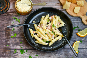  Fresh home made italian  penne  pasta   alla carbonara with  cream sauce  ,  bacon,egg, parmesan cheese ,olive oil and black pepper) 