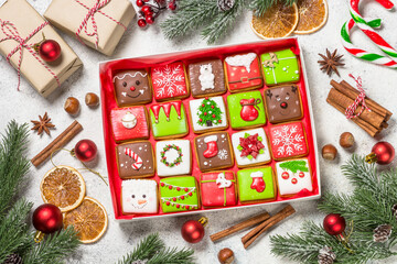 Christmas gingerbread cookies in present box with holidays decorations. Creative handmade present...