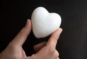 White heart in female hand.Organ donation and insurance concept.
World heart health concept. World organ donation day. Healthy heart concept for healthy life. Selective focus.