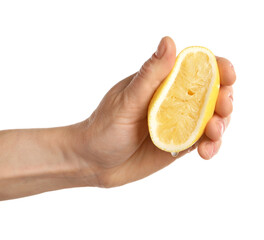 Woman squeezing lemon half on white background, closeup