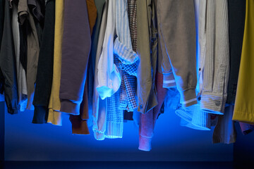 clothes in the wardrobe are in the blue light