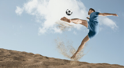 The man footballers are desperately playing beach soccer on sand on a sunny day