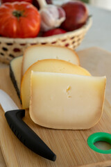 Cheese collection, French fol epi  cheese with many little holes, etorki, tomme noire des pyrenees and ossau iraty cheese