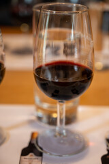 Professional tasting of different fortified dessert ruby, tawny port wines in glasses in porto cellars in Vila Nova de Gaia, Portugal
