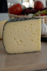Cheese collection, French fol epi  cheese with many little holes, etorki, tomme noire des pyrenees and ossau iraty cheese