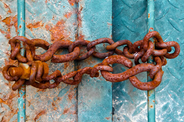 Rusted green metal plate with colourful profiles