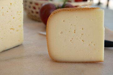 Cheese collection, French fol epi  cheese with many little holes, etorki, tomme noire des pyrenees and ossau iraty cheese