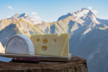 Cheese collection, French reblochon and emmental de savoie cheese served outdoor in Savoy region,...
