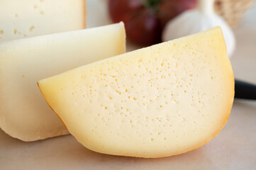 Cheese collection, French fol epi  cheese with many little holes, etorki, tomme noire des pyrenees and ossau iraty cheese
