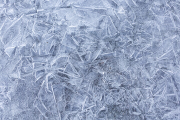 Obraz premium Abstract ice pattern on a frozen river. Background
