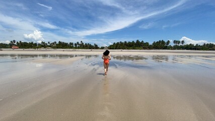 Woman running on the beach