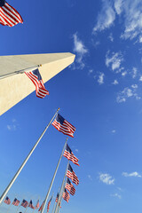 Washington Monument and waving  US Flags - Washington DC United States