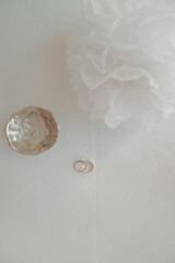 isolated golden rings, top view on light white background. just married concept, wife, hubby. Wedding card or invitation.