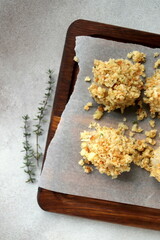 scallops in cheese breading before baking close-up selective focus, seafood.