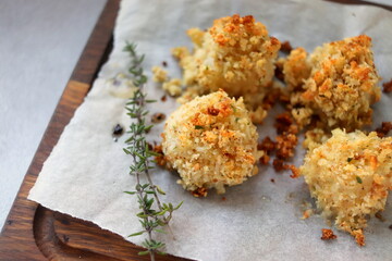 scallops in cheese breading baked close-up selective focus, seafood.