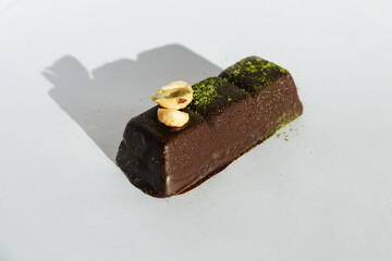 Close-up Vegan, chocolate candy with peanut on white background. Homemade bakery. Delicious and sweet.