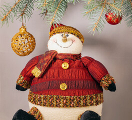 New Year banner with Christmas balls a Christmas tree and a snowman.