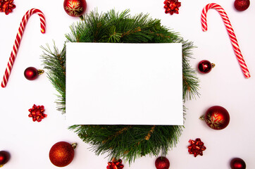 Fototapeta na wymiar Christmass flatlay white square with place for text and christmas tree toys