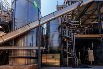 Modern winery. Stainless steel barrels for wine fermentation