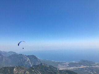Paragliders flying from a top of Tahtali mountain near Kemer, Antalya Province in Turkey. Concept...