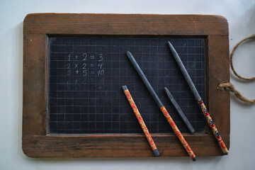 An old-fashioned board for teaching mathematics at school