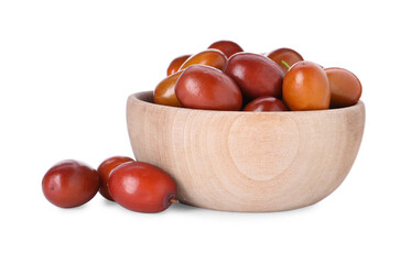 Ripe red dates in wooden bowl on white background