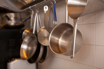 Close up of pans and pots at restaurant kitchen