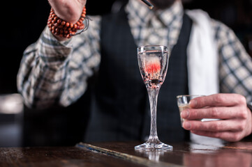 Barman formulates a cocktail on the pothouse