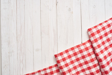 Red checkered tablecloth wooden background texture kitchen decoration