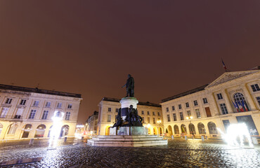 Obraz premium Statue Louis XV at Place Royal decorated for Christmas in Reims - France