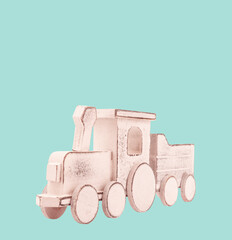 Wooden toy train locomotive vintage isolated on square green background. Childhood memory or gift for kids