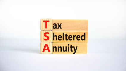 TSA, tax sheltered annuary symbol. Concept words TSA, tax sheltered annuary on wooden blocks....