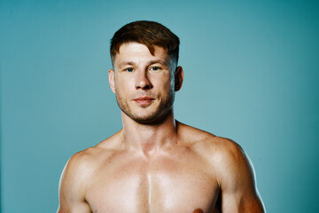 handsome sporty man with pumped body workout fitness