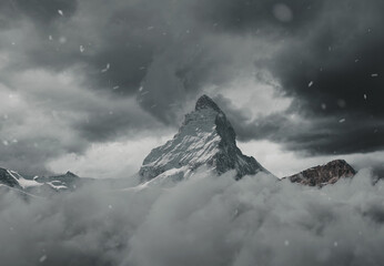 view to the majestic Matterhorn mountain covered by grey clouds