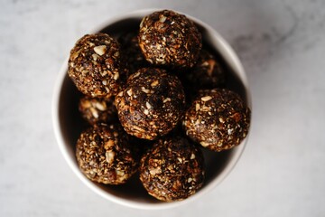 No bake raw energy protein balls with oats nuts and dates, selective focus