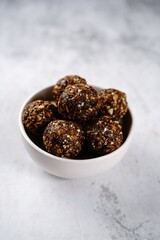 No bake raw energy protein balls with oats nuts and dates, selective focus