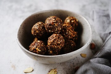 No bake raw energy protein balls with oats nuts and dates, selective focus