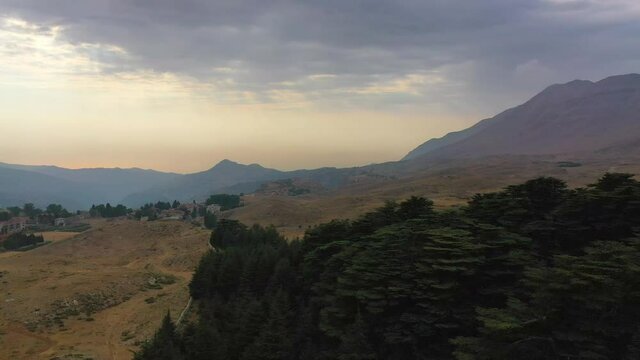 Aerial Panning Beautiful Shot Of Mountains During Sunset, Drone Flying Over Trees On Landscape - Bsharri, Lebanon