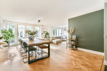 Stylish living room with a large comfortable sofa combined with a dining room