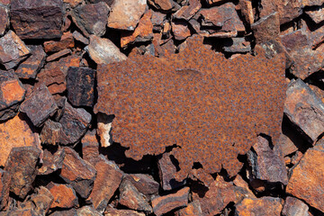 Rusty iron plate against background of rusty pieces of metal. Old metal surface, corrosion....
