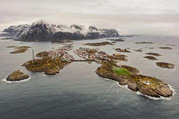 Outstanding aerial winter panorama of Henningsvær, Lofoten Islands. World famous soccer field. A little fishing town. Epic Moutains. Nordland region.